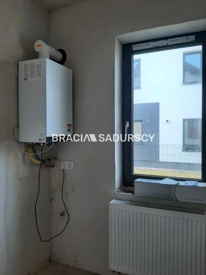 Nowoczesne domy w zabudowie bliźniaczej z garażem